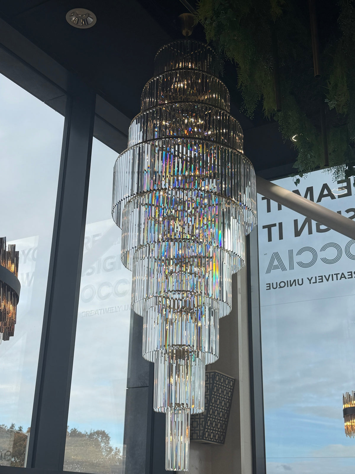 Luxury bespoke tiered crystal chandelier on display in the Dream Interiors Preston showroom