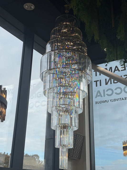 Luxury bespoke tiered crystal chandelier on display in the Dream Interiors Preston showroom